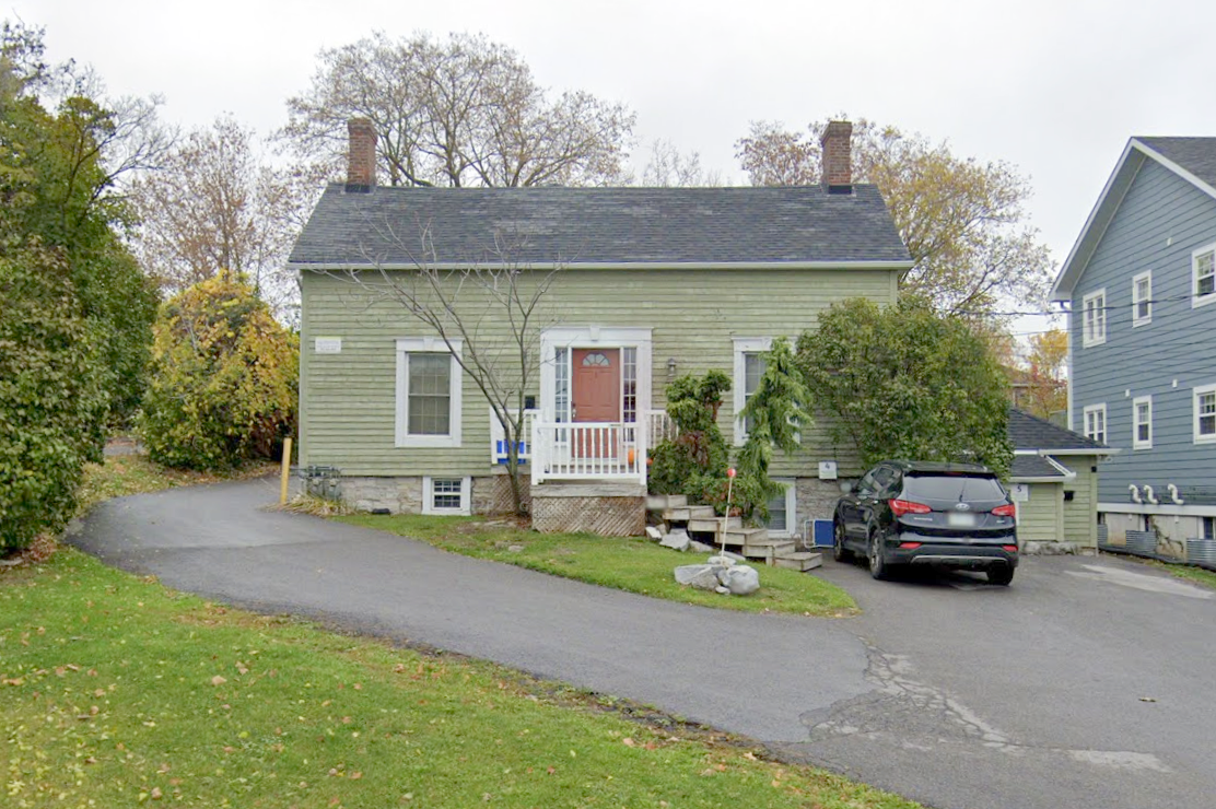 A representative example of an early19th century one-and-a-half storey wood frame Georgian cottage