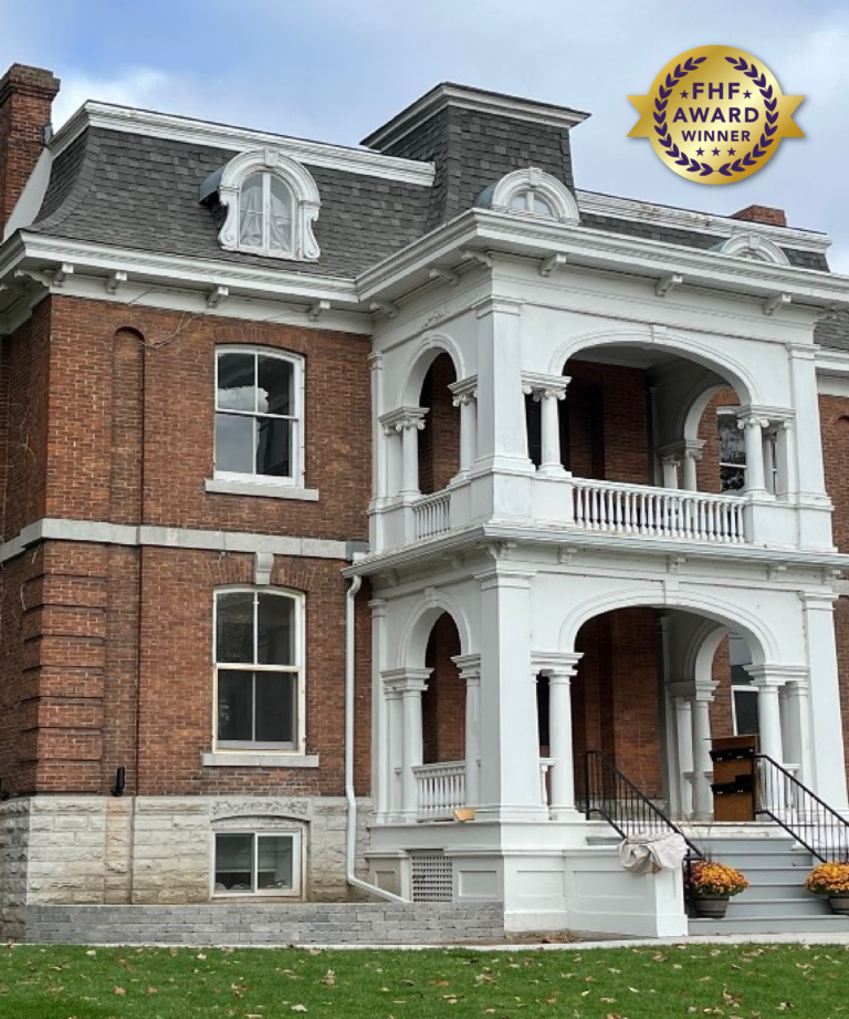 A 2½ storey, three-bay dwelling is a picturesque example of Victorian architecture in Kingston, Ontario's Old Sydenham Heritage Conservation District