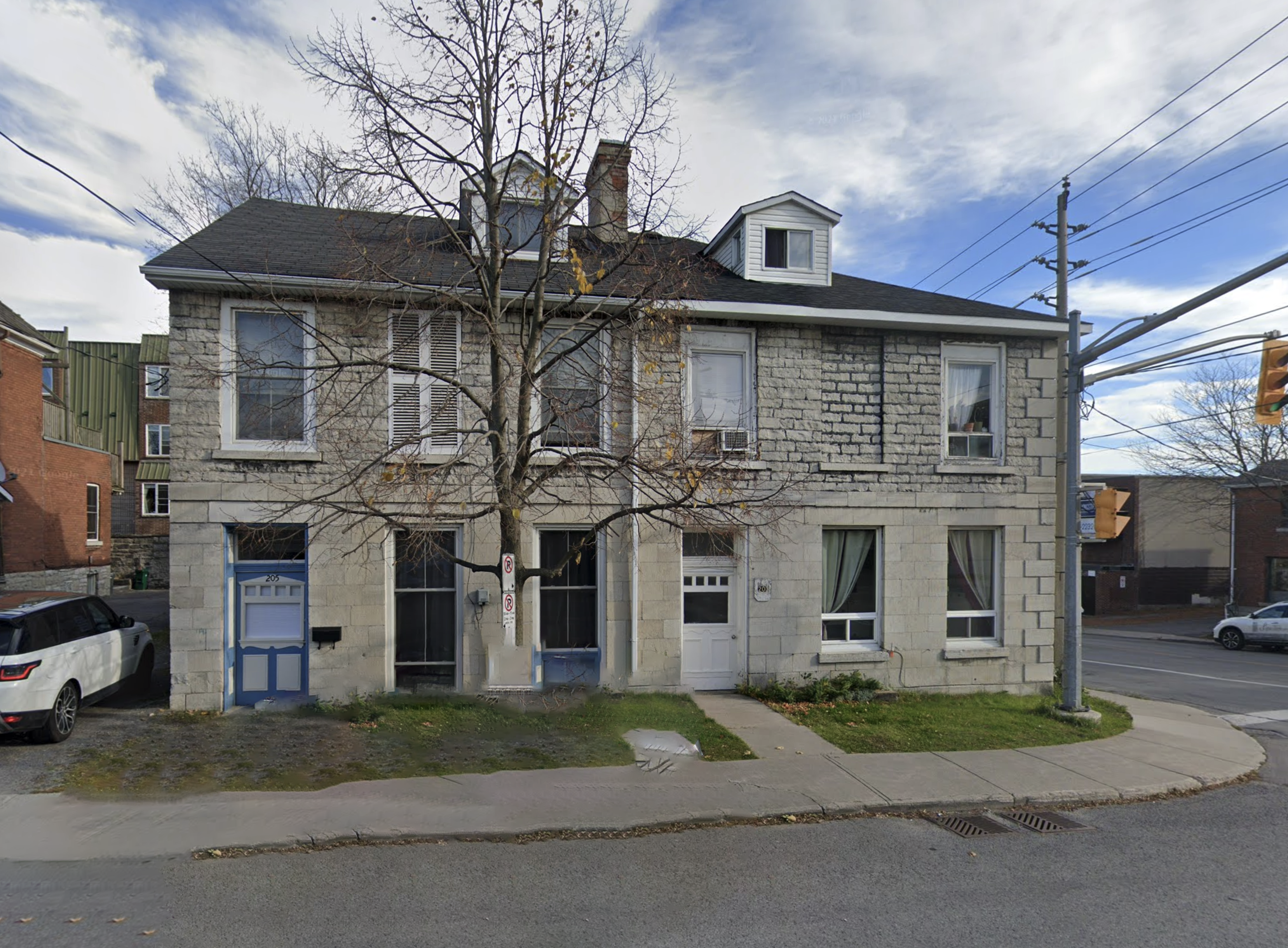 an early example of a limestone double-house in Kingston